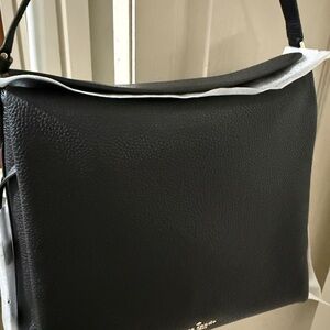 Kate Spade Black Shoulder Bag. Dumpling Pebbled Leather Large; magnetic closure.